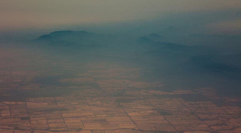 Smoke haze over mountains near Cooma, New South Wales, as viewed from a No 11 Squadron P-8A Poseidon conducting damage assessment and surveillance in the bushfire-affected area. Photo by Sergeant Murray Staff.