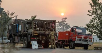 Private Richard Crisp from the Australian Army's 2nd Combat Engineer Regiment conducts morning checks and prepares to refuel a NSW Bush Fire Service vehicle near Tumut, NSW. Photo by Lance Corporal Brodie Cross.