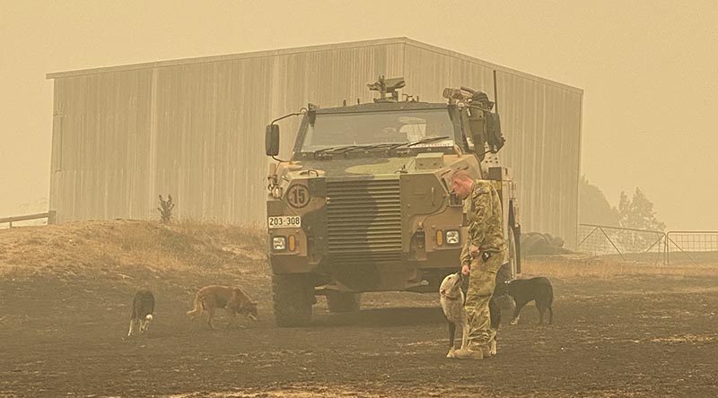 Australian Army Trooper Duncan Rough on a property in Gelantipy conducts damage assessments and checks on the wellbeing of local farmers.