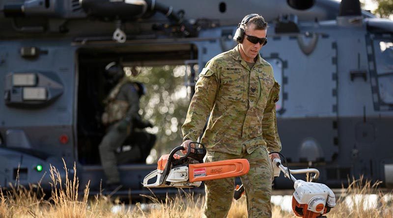 Sergeant Joshua Howlett, 7RAR, disembarks a Royal New Zealand Air Force NH90 to conduct land clearing and fuel reduction on Brindabella Mountain, west of Canberra. Photo by Signaller Robert Whitmore.