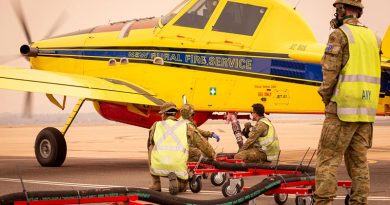 Soldiers from the 1st/19th Battalion, Royal New South Wales Regiment, refill fire retardant solution for a New South Wales Rural Fire Service plane in Canberra during Operation Bushfire Assist 19-20. Photo by Signalman Robert Whitmore.