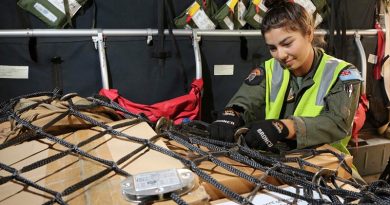 Corporal Antonia Guterres, a Loadmaster at No. 35 Squadron, secures cargo to be taken from RAAF Base East Sale to Mallacoota on the C-27J Spartan during Operation Bushfire Assist 19-20. Photo by Corporal Kylie Gibson.