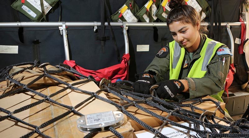 Corporal Antonia Guterres, a Loadmaster at No. 35 Squadron, secures cargo to be taken from RAAF Base East Sale to Mallacoota on the C-27J Spartan during Operation Bushfire Assist 19-20. Photo by Corporal Kylie Gibson.