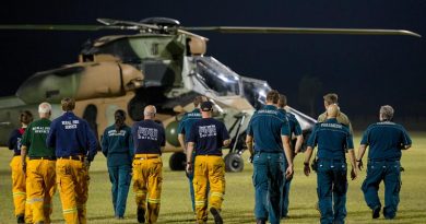 Emergency Service personnel from across Australia receive a brief on the thermal imagery capability of the ARH-Tiger helicopter as aircraft from the Army School of Aviation continue to provide specialised reconnaissance support to help identify and combat the bushfires in the Yeppoon Area. Photo by Trooper Jonathan Goedhart.