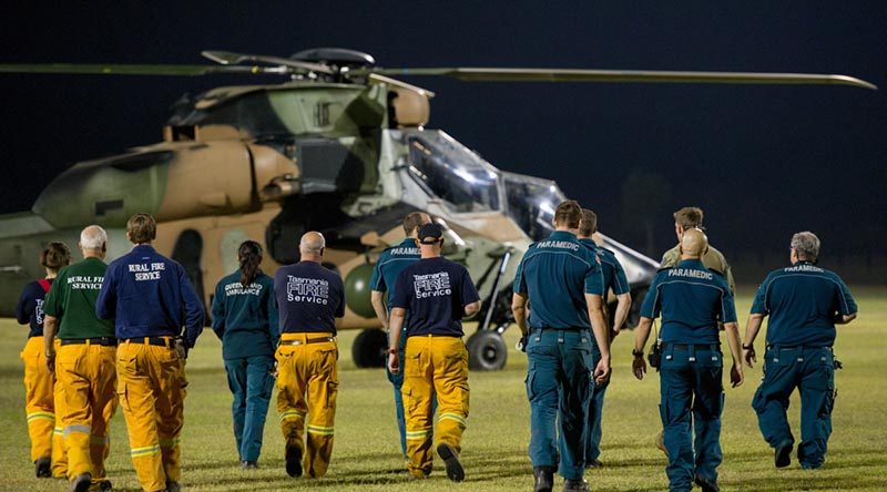 Emergency Service personnel from across Australia receive a brief on the thermal imagery capability of the ARH-Tiger helicopter as aircraft from the Army School of Aviation continue to provide specialised reconnaissance support to help identify and combat the bushfires in the Yeppoon Area. Photo by Trooper Jonathan Goedhart.