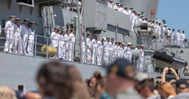 Officers and sailors on HMAS Toowoomba line the upper decks as to farewell family, friends and colleagues as the ship departs for Operation Manitou from Fleet Base West, Western Australia. Photo by Leading Seaman Ronnie Baltoft.