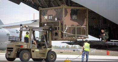 No. 23 Squadron air movements personnel load an Australian Army 6th Engineer Support Regiment water purification system on to a C-17A Globemaster at RAAF Base Amberley, destined for Kangaroo Island off South Australia. Photo: Corporal Jessica de Rouw.