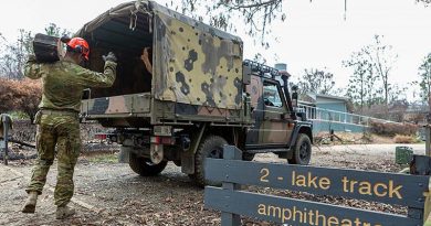 Corporal Travis Ward, 6RAR, loads a G-Wagon with debris at the Eurobodalla Regional Botanic Gardens, NSW. Photo by Corporal Dan Pinhorn.