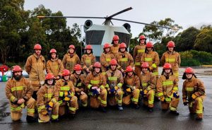 Australian Navy Cadets and staff in fire-fighting gear at the Bell Bay fire-training grounds.