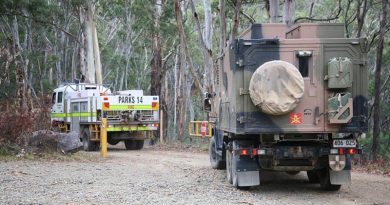 An Australian Army G-Wagon six-wheel-drive ambulance follows an ACT fire truck onto Mt Franklin Road for the drive to the edge of the Orroral Valley fire. Photo by Major Cameron Jamieson.