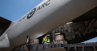 RAAF No 22 Squadron Air Movements Section personnel prepare to unload fire retardant from a Royal Canadian Air Force CC-177A Globemaster III at RAAF Base Richmond during Operation Bushfire Assist. Photo by Corporal David Said.