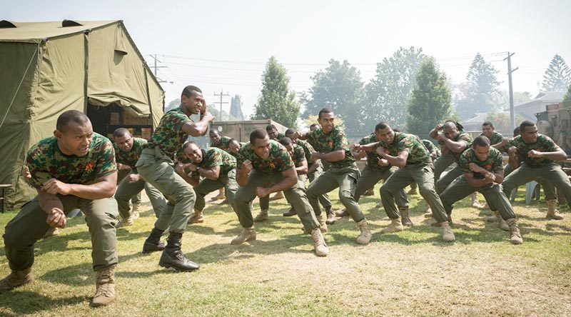 Soldiers from the Republic of Fiji Military Forces perform a cultural dance to welcome students visiting from Newmerella Primary School as part of a visit to the Orbost Football Oval, headquarters for the assistance effort during Operation Bushfire Assist 19-20 in Victoria. Photo by Leading Aircraftman John Solomon.