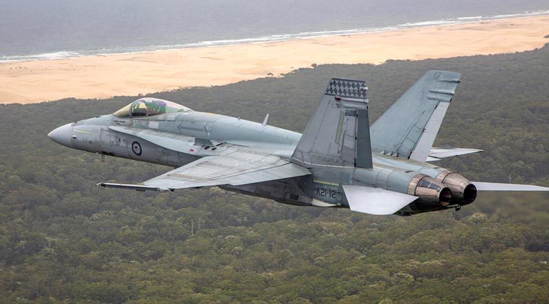 An F/A-18A Hornet over the Western Australian coast. Photo by Corporal Craig Barrett.