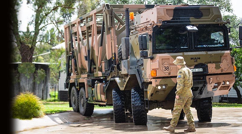 Australian Army soldier Lance Corporal Lewis James from the 3rd Combat Engineer Regiment, guides Corporal Steven Wilson from the 3rd Combat Service Support Battalion driving a MAN HX77 water resupply module vehicle in support of Operation Bushfire Assist 19-20. Photo by Private Madhur Chitnis.