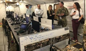 US Army Colonel John Conklin, chief of staff of the International Maritime Security Construct, explains the salubrious headquarters of the IMSC to reporters – 4.01pm 25 Nov 2019.