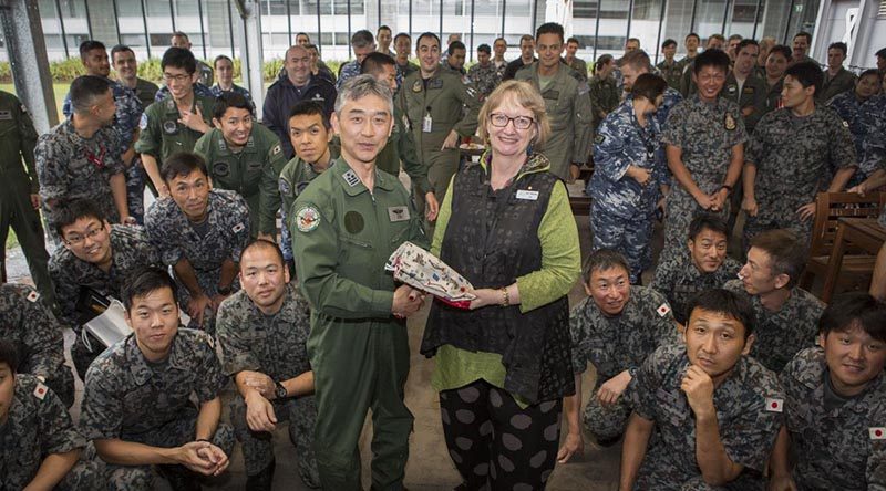 Jan-Maree Ball, of Aussie Hero Quilts, presents Colonel Ota Masashi with a laundry bag at a farewell barbecue for members of the Japan Self-Defense Force. All contingent members were presented with the Aussie Hero Quilts special gift. Photo by Corporal Casey Forster.