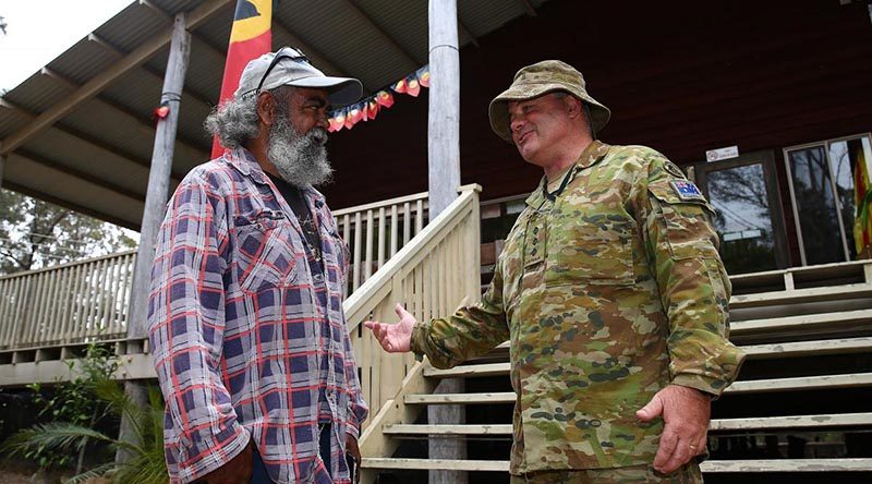 Worimi man Captain Shane James speaks with Yuin elder Uncle Glenn Campbell at the Merrimans Local Aboriginal Land Council. Photo by Sergeant Max Bree.