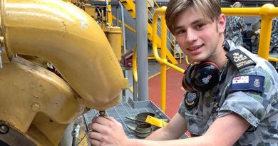 A participant in the inaugural Australian Navy Cadets MC Maritime Skills Camp gets hands-on with a marine diesel engine.