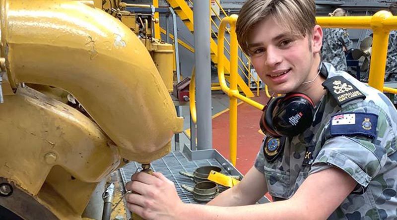 A participant in the inaugural Australian Navy Cadets MC Maritime Skills Camp gets hands-on with a marine diesel engine.