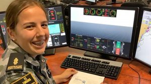 A cadet learns navigation and 'rules of the road' on a mini simulator.