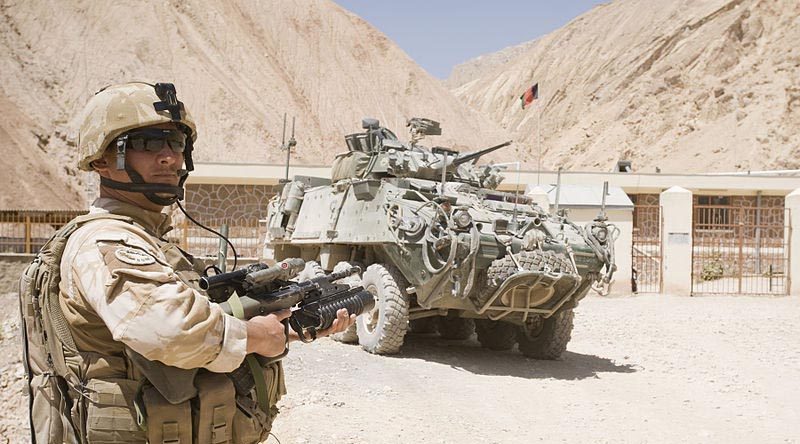 A New Zealand soldier and NZLAV on patrol in north-east Bamyian province, Afghanistan. NZDF photo.