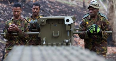 Papua New Guinea Defence Force soldiers carry a component of a temporary medium girder bridge installed at Buchan Caves during Operation Bushfire Assist. Photo by Leading Seaman Kieran Whiteley.