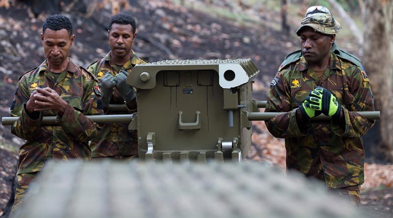 Papua New Guinea Defence Force soldiers carry a component of a temporary medium girder bridge installed at Buchan Caves during Operation Bushfire Assist. Photo by Leading Seaman Kieran Whiteley.