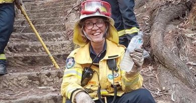 Squadron Leader Del Gaudry takes a rest from the front line in her other role as a volunteer firefighter, in the Blue Mountains.