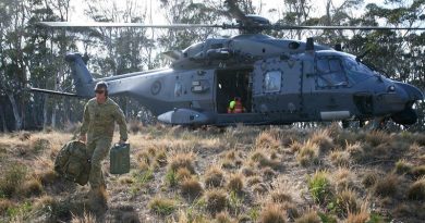 Sergeant Joshua Howlett carries equipment from a 3 Squadron, Royal New Zealand Air Force, NH-90 helicopter in Namadgi National Park, west of Canberra city. Photo by Major Cameron Jamieson.
