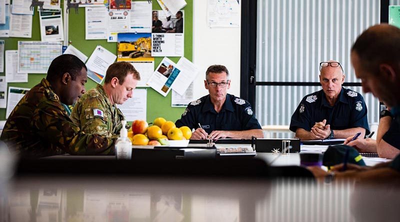 Captain Levi, of the PNG Defence Force, and Lieutenant Scott Bowers in a meeting with members of Victoria Police at the Swift Creek Incident Control Centre during Operation Bushfire Assist. Photo by Private Madhur Chitnis.