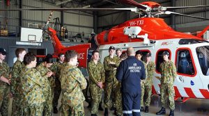 Matt Doyle, an Air Ambulance pilot, discusses the AgustaWestland AW139 helicopter with Air Force Cadets from 413 Squadron, Warrnambool. Photo by PLTOFF(AAFC) Jane McDonald.