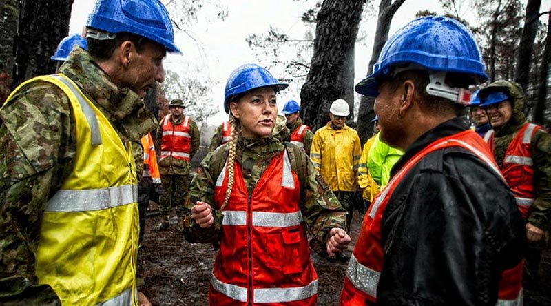 Lieutenant Colonel Renee Kidson updates Major General Justin Ellwood, left, and TNI Lieutenant Colonel Teddi on the work being conducted by troops at the Zig Zag Railway. Photo by Flight Sergeant Ricky Fuller.