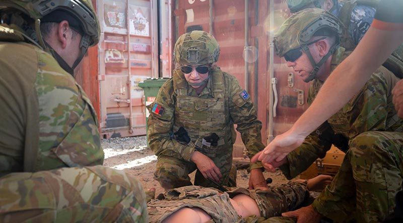 Senator Hollie Hughes participates in combat first aid training during her visit to Australia’s main operating base in the Middle East region. Photo by Leading Seaman Craig Walton.