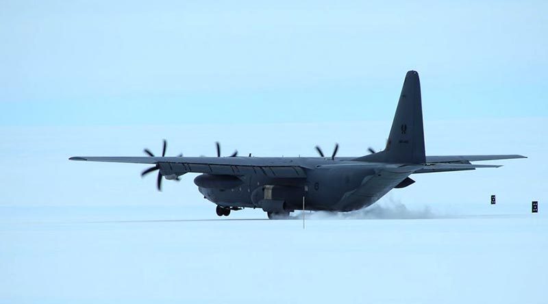 An RAAF C-130J Hercules lands at Wilkins Runway, Antarctica. Photo by Christopher Burns, Australian Antarctic Division.