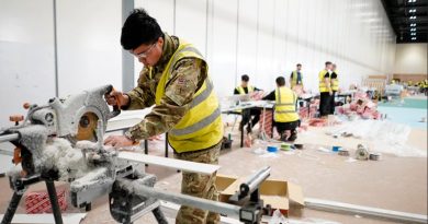 A British Army engineer works on fixings at the NHS Nightingale hospital in London's Docklands. UK MoD photo.