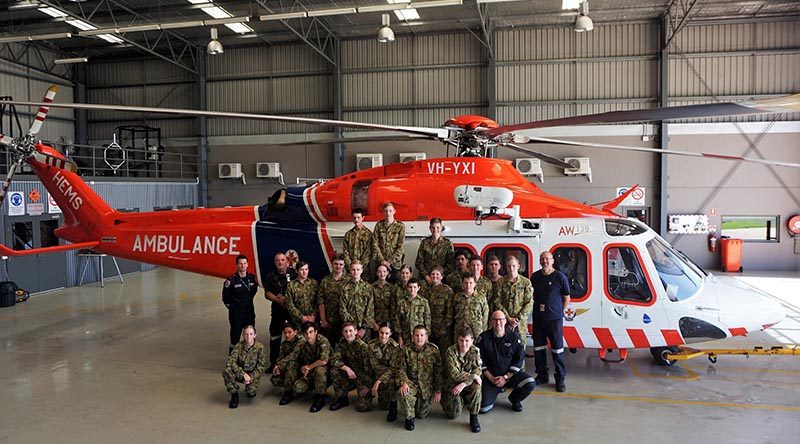 Air Force Cadets from Warrnambool’s 413 Squadron with the HEMS4 AgustaWestland AW139 helicopter. The HEMS4 MICA Flight Paramedic Andrew Osborne is on the far left of the group. Photo by PLTOFF(AAFC) Jane McDonald.