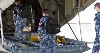 Australian Defence Force medical and scientific personnel from the Army, Air Force and Navy board a C-130J Hercules at RAAF Base Amberley, Queensland, travelling to assist with a recent COVID-19 outbreak at North West Regional Hospital in Burnie, Tasmania. Photo by Trooper Jonathan Goedhart.