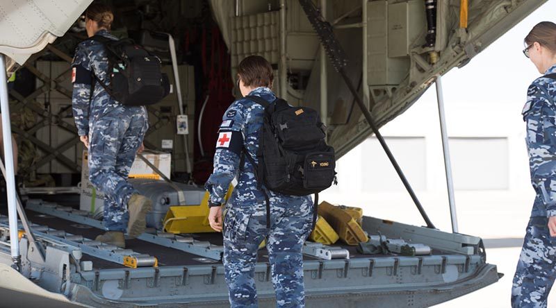 Australian Defence Force medical and scientific personnel from the Army, Air Force and Navy board a C-130J Hercules at RAAF Base Amberley, Queensland, travelling to assist with a recent COVID-19 outbreak at North West Regional Hospital in Burnie, Tasmania. Photo by Trooper Jonathan Goedhart.