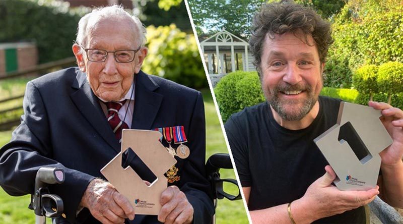 Captain Tom Moore and his singing partner – and favourite singer – Michael Ball show off their Number One charts award after their cover of You'll Never Walk Alone debuted at Number 1. Photo courtesy Official Charts web site.