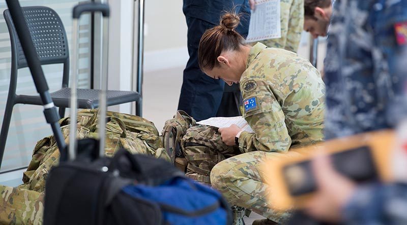 Australian Defence Force medical and scientific personnel from the Army, Air Force and Navy boarded a C-130J Hercules aircraft at Royal Australian Air Force Base Amberley, Queensland, travelling to assist with a recent COVID-19 outbreak at North West Regional Hospital in Burnie, Tasmania. Photo by Trooper Jonathan Goedhart.