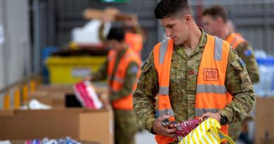Australian Army soldier Private Jack Barrie sorts donations at the Foodbank warehouse in Glendenning, NSW, as part of Defence's Operation COVID-19 Assist. Photo by Corporal Chris Beerens.