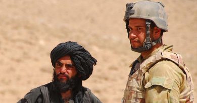 Private Jesse Bird interacts with a local at a vehicle check point while deployed with Mentoring and Reconstruction Task Force 2 (MRTF2). Photo by Corporal Rachel Ingram.