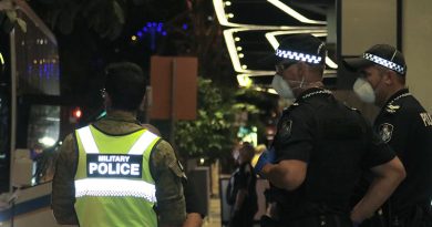 Australian Army military police and Queensland police stand guard outside The Westin, Brisbane, as more  more Aussies coming off overseas flights arrive for quarantine. Photo by CONTACT stringer Christabel Migliorini.