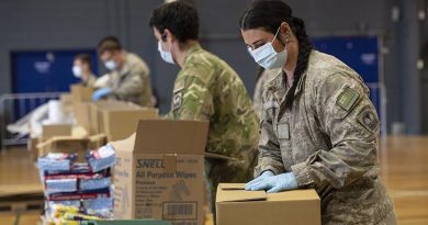 New Zealand Defence Force personnel from Palmerston North help pack more than 2500 care packages for families in need in remote areas. NZDF photo.