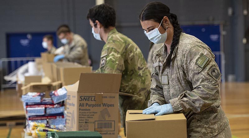 New Zealand Defence Force personnel from Palmerston North help pack more than 2500 care packages for families in need in remote areas. NZDF photo.