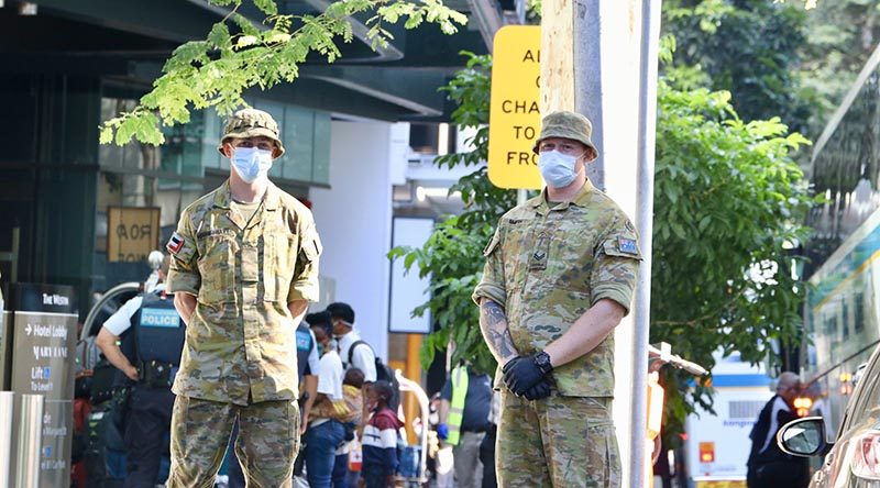 Private Rovere-Bray and Corporal Smith, 9th Battalion, Royal Queensland Regiment, supporting mandatory COVID-19 quarantine arrangements at a Brisbane hotel as new overseas arrivals check in for their mandatory 14 days of isolation after arriving at Brisbane Airport from overseas. Photos by CONTACT stringer Christabel Migliorini – who almost copped a $1500 'non-essential travel' fine in taking these photos. Follow Chrissie on Instagram.