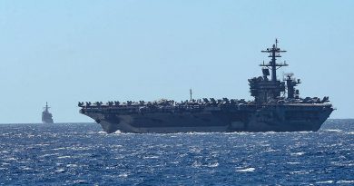 The aircraft carrier USS Theodore Roosevelt and the Ticonderoga-class guided-missile cruiser USS Bunker Hill transit the Philippine Sea in February. US Navy photo by Mass Communication Specialist 3rd Class Sean Lynch.