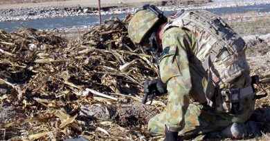 Flight Sergeant Damian Holding conducting a search for unexploded ordnance in Afghanistan.