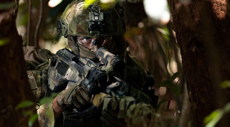 A sniper from the 2nd Battalion, Royal Australian Regiment, patrols through the Cowley Beach Training Area, north Queensland. Photo by Corporal Tristan Kennedy.