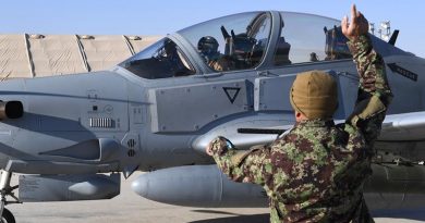 An Afghan Air Force A-29 Super Tucano crew chief give signals to his pilot before takeoff at Kandahar Airfield, Afghanistan. The AAF has an approved strength of about 8000 aircrew, maintainers and support staff. AAF is based at three air wings and multiple detachments across Afghanistan. US Air Force photo by Staff Sergeant Sean Martin.